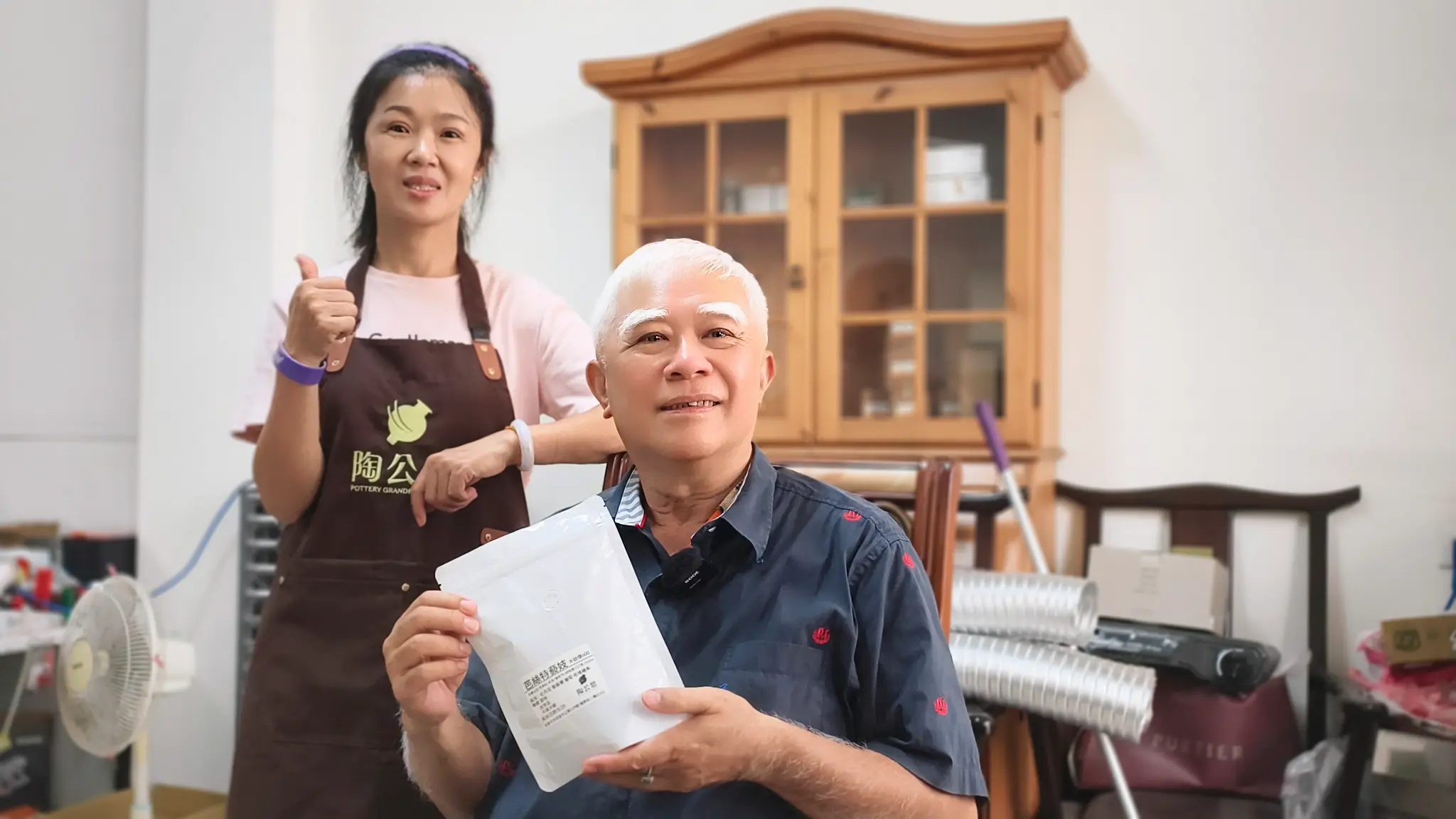陶公鼎精品咖啡老闆吳永海和國華店店長馮美金。